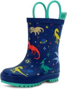Toddler wearing waterproof rain boots with pull-on handles, standing outdoors in rainy weather