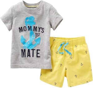 Toddler boy wearing a casual summer outfit set with graphic t-shirt and matching shorts