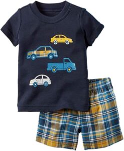 Toddler boy wearing a soft cotton summer short set with playful dinosaur print and matching shorts
