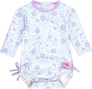 Baby girl wearing a RuffleButts Flamingo Frenzy one piece swimsuit with ruffle back detail, floral flamingo print, and UPF 50+ sun protection for beach and pool wear Baby girl wearing a RuffleButts Flamingo Frenzy one piece swimsuit with ruffle back detail, floral flamingo print, and UPF 50+ sun protection for beach and pool wear