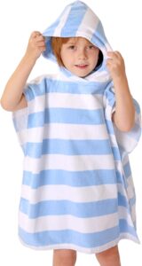 Toddler wearing a TBEZY hooded poncho towel made from thick soft cotton with absorbent terry lining for bath, beach, or pool use Toddler wearing a TBEZY hooded poncho towel made from thick soft cotton with absorbent terry lining for bath, beach, or pool use