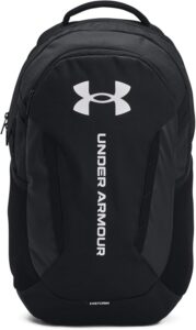 Under Armour Hustle 6.0 backpack in Castlerock Heather with laptop sleeve, zippered pockets, and side water bottle pocket